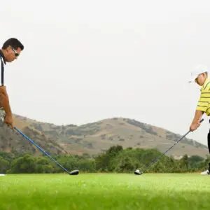 two men playing golf